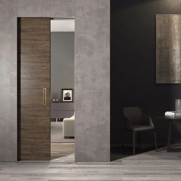 Modern wood pocket door sliding into the wall in a contemporary interior