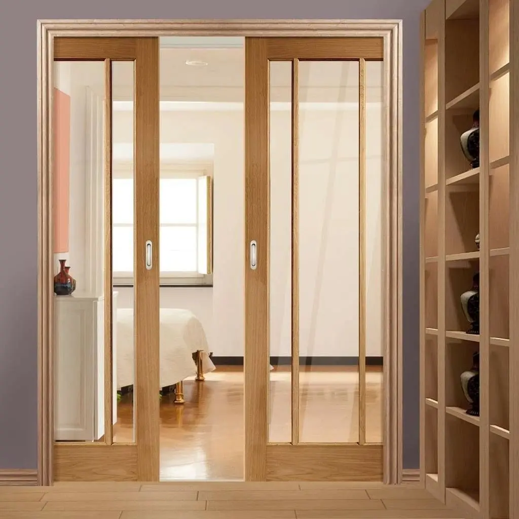 Double glass pocket doors with wood frames for a bedroom entrance